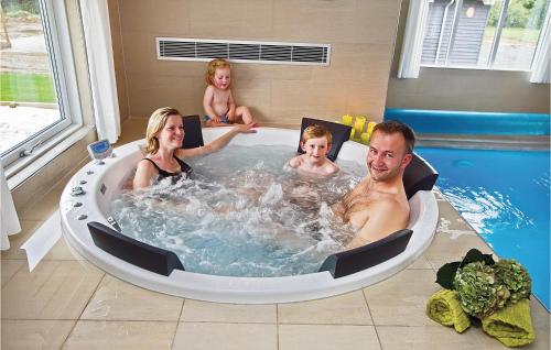 a group of people sitting in a jacuzzi tub at Beautiful Home In Sydals With Wifi in Høruphav