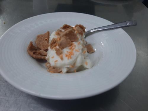 a plate of food with ice cream and waffles at Hotel La Fattoria Sul Mare in Capo Vaticano