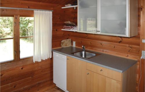 a kitchen with a sink and a counter top at 3 Bedroom Beautiful Home In lbk in Ålbæk