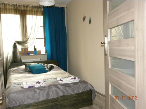 Posteľ alebo postele v izbe v ubytovaní Apartament U Anny