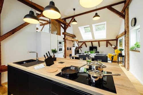 a kitchen with a counter top with pots and pans at Loft v historickom centre in Trenčín