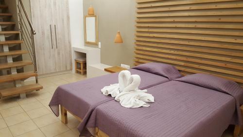 En eller flere senge i et værelse på Blue Sky Hotel Apartments