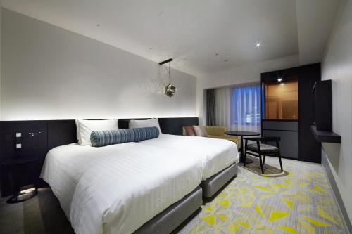 Ένα ή περισσότερα κρεβάτια σε δωμάτιο στο Osaka Excel Hotel Tokyu