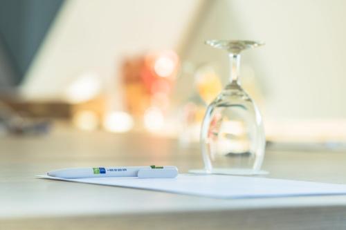 a thermometer sitting on a counter next to an hourglass at Holiday Inn Express Luzern-Neuenkirch by IHG in Rothenburg