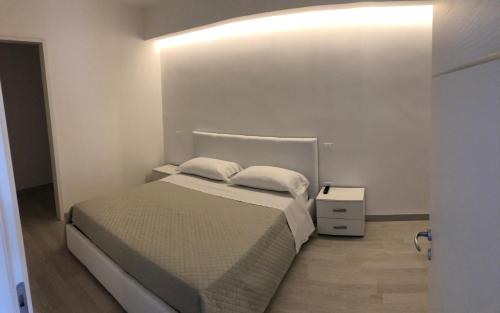 a bedroom with a bed with two pillows on it at Attico Lady D in Paola