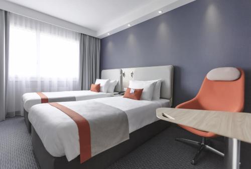 Postel nebo postele na pokoji v ubytování Holiday Inn Express Luzern-Neuenkirch by IHG