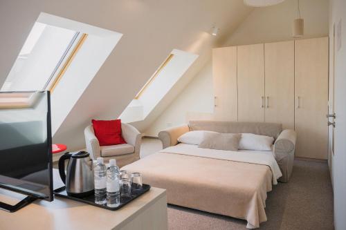 Postel nebo postele na pokoji v ubytování Art Hotel