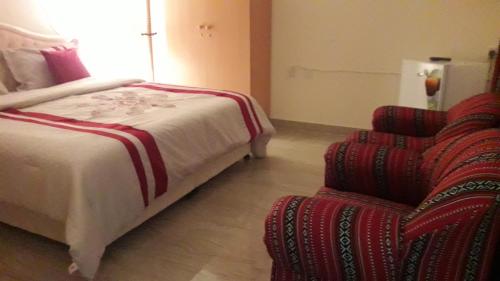 Cama ou camas em um quarto em Ahlam Villa Musandam