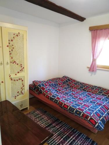 a bedroom with a bed in a room at Jana in Bukovac