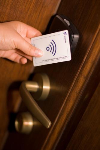 a person holding a cell phone unlocking a door at Anthimos in Baile Felix