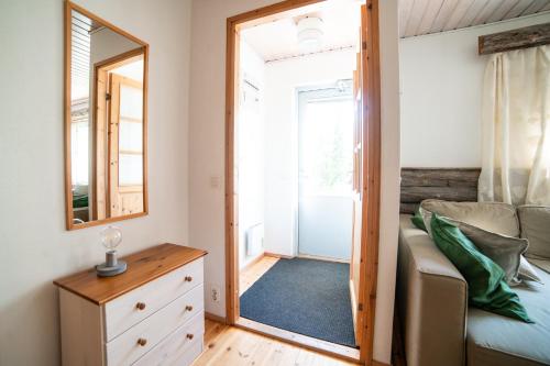 a small bedroom with a mirror and a bed at Holiday Home Etelärinne E - Ruka Jurmuntie 10 in Kuusamo