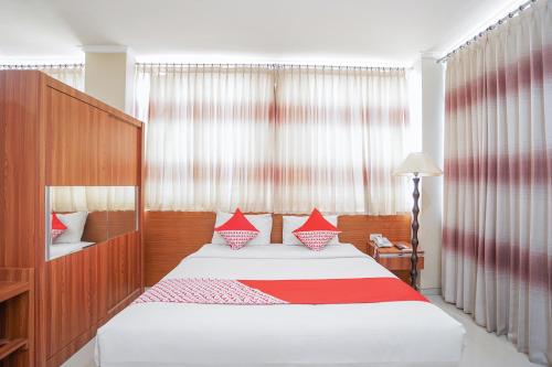 Ein Bett oder Betten in einem Zimmer der Unterkunft Maumu Hotel & Lounge