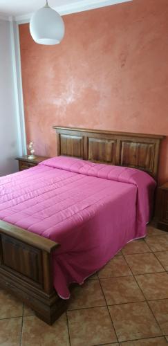 En eller flere senge i et værelse på Casa con Giardino privata nel Centro Città
