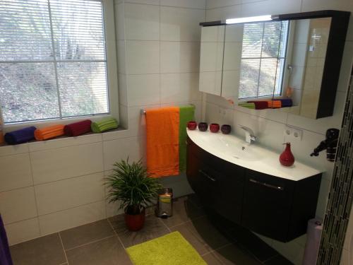 a bathroom with a sink and a mirror at 4 Jahreszeiten in Tamsweg