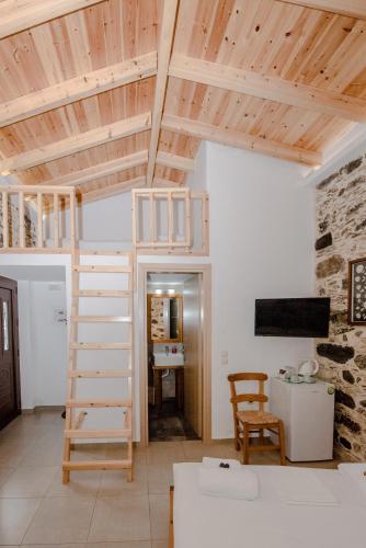 a room with a loft bed and a desk at Fairytale Elafonisi in Elafonisi