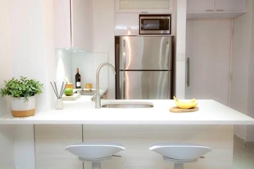 a kitchen with a sink and a refrigerator at Waterfront studio at Fajardo, Puerto Rico in Fajardo