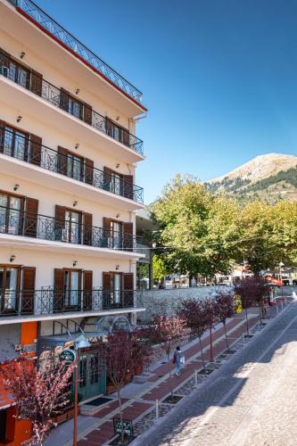 a building on the side of a street at City Hotel Apollonion in Karpenision