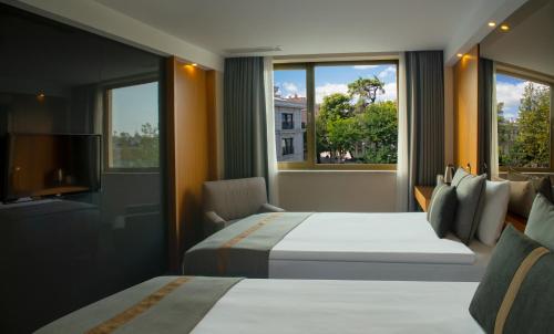 Säng eller sängar i ett rum på Tan Hotel - Special Category