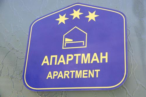 a blue sign that reads artificial enchantment appointment at Dolce Casa in Belgrade