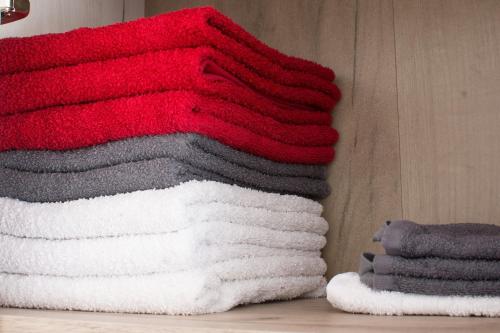 a pile of towels sitting on top of a shelf at Dolce Casa in Belgrade