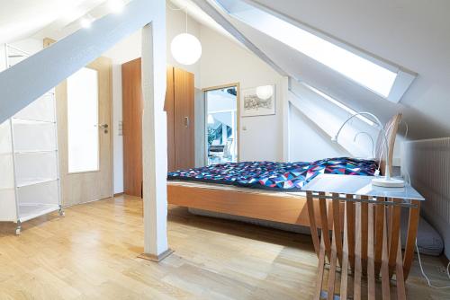 a bedroom with a bed and a table in it at Ferienwohnung Sillack in Dresden