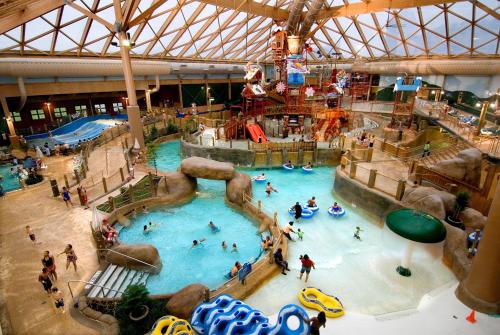 an overhead view of a water park with people in it at Massanutten's Woodstone Meadows by TripForth in McGaheysville
