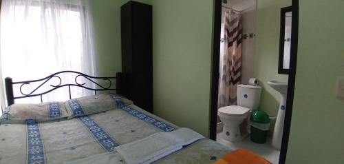 Postel nebo postele na pokoji v ubytování Hospedaje Alto de San Luis - Vivienda Turística RNT-90280