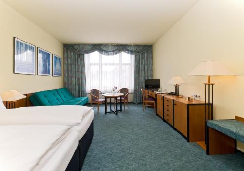 Postel nebo postele na pokoji v ubytování Hotel Katharinenhof