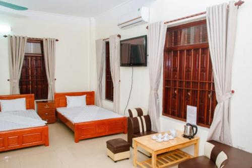 Katil atau katil-katil dalam bilik di Homestay Xuandung