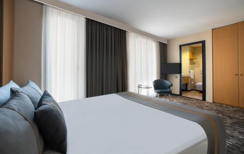 Postel nebo postele na pokoji v ubytování Tan Hotel - Special Category