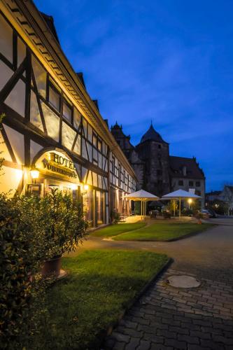 a building with a sign that reads hope and intimacy at Hotel Vorderburg in Schlitz