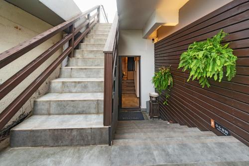 a set of stairs leading up to a door at Li River Resort Villa Hotel in Guilin