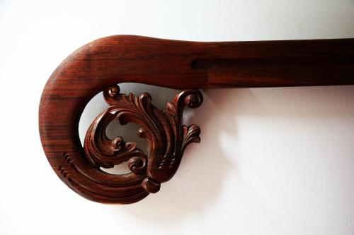 a wooden object hanging on a wall at Hospedaje Casa Real in Salamina