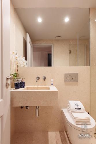 a bathroom with a sink and a toilet at ON/SET Alfama - Lisbon Cinema Apartments in Lisbon