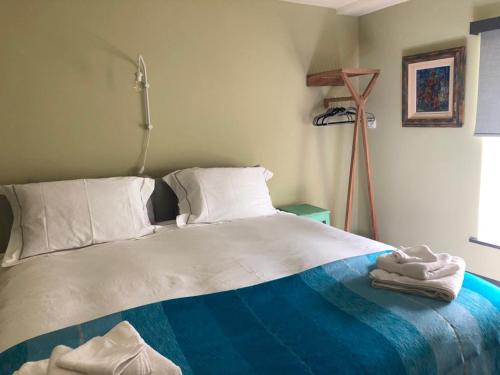 a bedroom with a bed with towels on it at Lady Charlotte's Loft in Schull