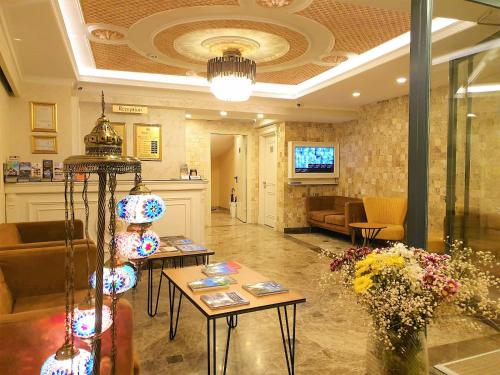 a lobby with couches and tables in a building at Boss Hotel Sultanahmet in Istanbul