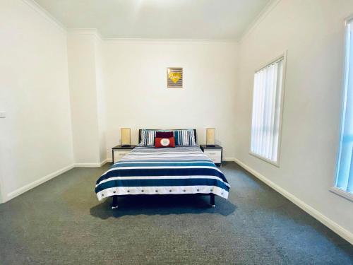 Lova arba lovos apgyvendinimo įstaigoje Edmondson Villas Sydney
