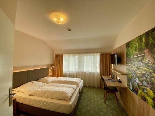 Tempat tidur dalam kamar di Römerhof