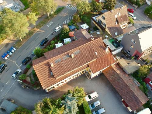 an overhead view of a large house with a roof at Römerhof in Stuttgart