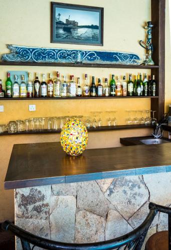 a counter in a bar with a ball on it at Karen Gables in Nairobi