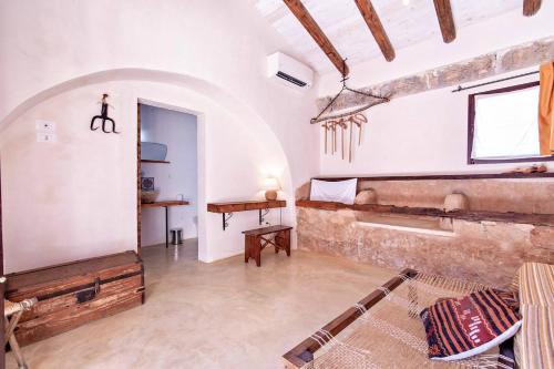 a room with a bed and a table in it at Casina Solatia in Nardò