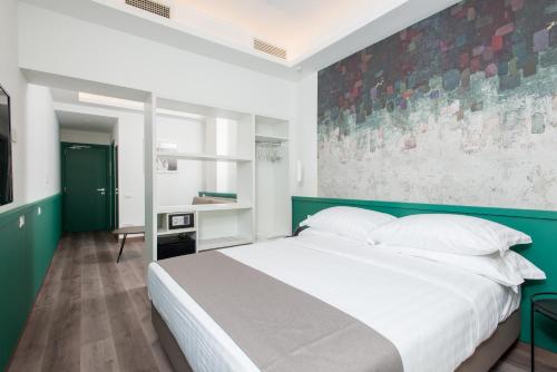 Ein Bett oder Betten in einem Zimmer der Unterkunft Smart Hotel Napoli