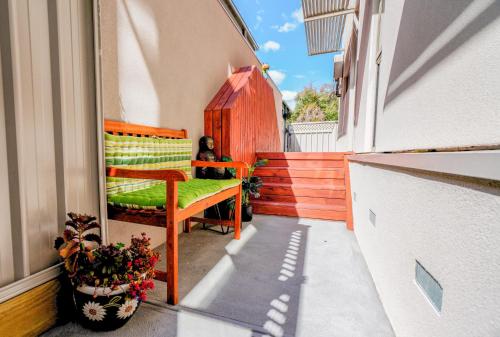 a small balcony with a bench on a building at U201 Brunswick Living Top floor Balcony Close to APT and CBD Free Wifi Tram at Doorstep in Melbourne