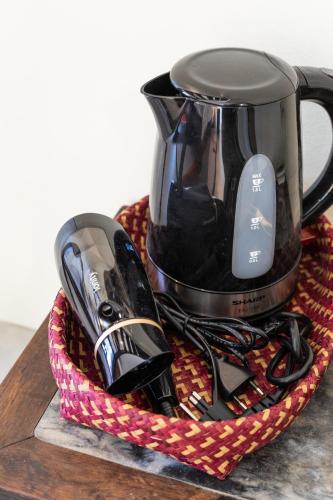 a basket with a coffee appliance on a table at Baan Boon in Bangkok