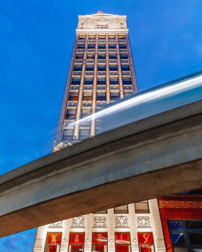 a tall building with a blue sky in the background at The Siren Hotel, an Ash Hotel in Detroit