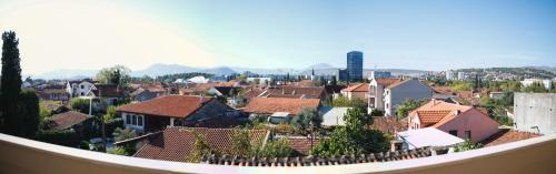 a view of a town with houses and roofs at Hotel Bojatours in Podgorica