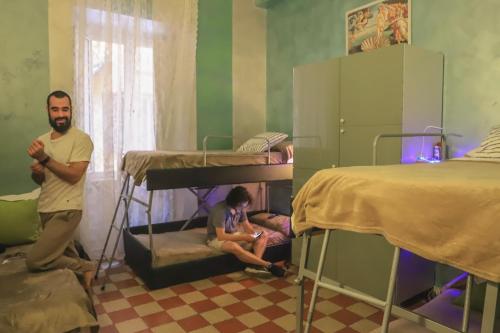 a man in a hospital bed with a baby at Român Holidays in Rome