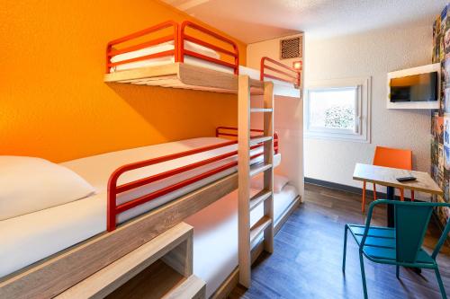 a bedroom with a bed and a desk at hotelF1 Le Mans Nord in Saint-Saturnin
