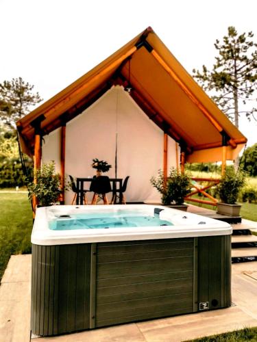 a jacuzzi tub in the backyard of a house at Villaggio La Pescaccia in San Clemente