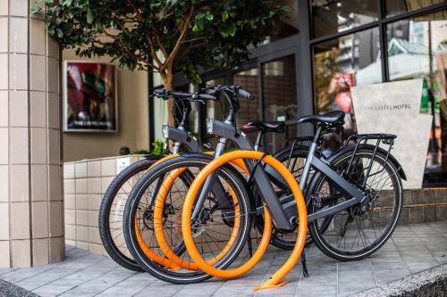 a group of bikes parked next to each other on a sidewalk at The Listel Hotel Vancouver in Vancouver